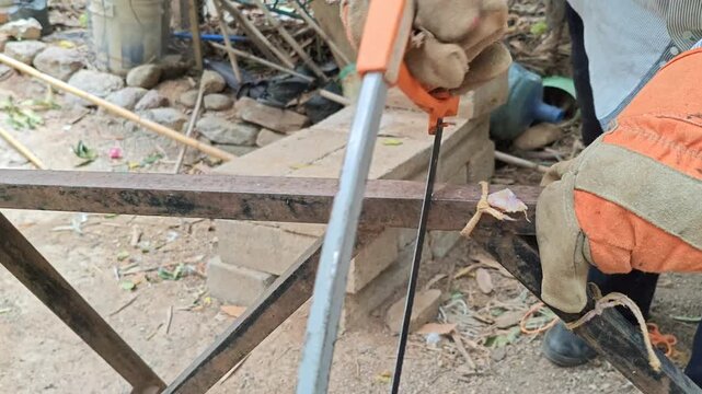 Close Up Hacksaw Cutting Iron Angle Bar Steel Frame Manual Tool