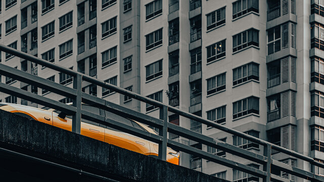 Monochrome High-Rise Apartment Window Pattern with Elevated Highway Railing