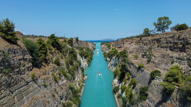 Drone View Over Corinth Canal With Boats and Turquoise Water, Greece