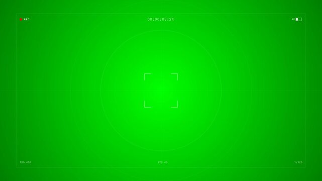 Green screen background with digital camera viewfinder overlay displaying central focus brackets and settings