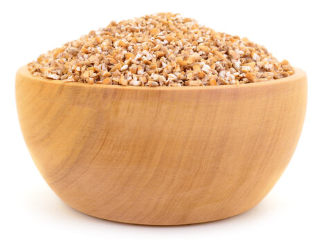 cracked wheat groats in wooden bowl isolated on white background