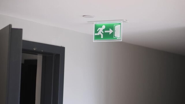 Exit sign above a hallway in a building