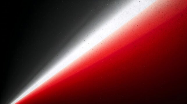 Abstract bright red and white light beam diagonal streak on a dark black background with glowing effect