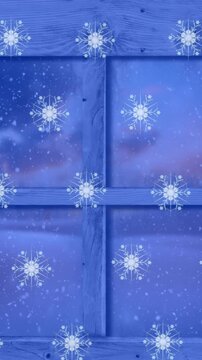 Animation of snowflakes over window with baubles and winter landscape