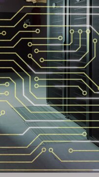 Animation of circuit board pattern against data server racks in server room