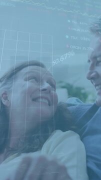 Animation of graphs and trading boards over senior caucasian couple spending quality time at home