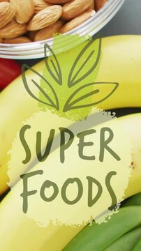 Super Foods text animation over bananas, cherry tomatoes, almonds, and snap peas