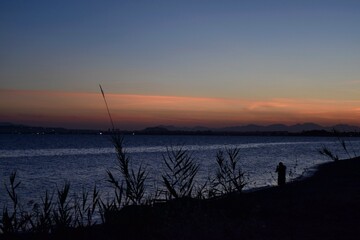 Obraz premium fishing at sunset Alba Cagliaro Sardegna sardinia Italia italy 