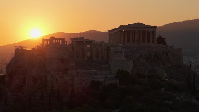 Stunning sunset aerial view of Parthenon temple on Acropolis hill in Athens Greece.
