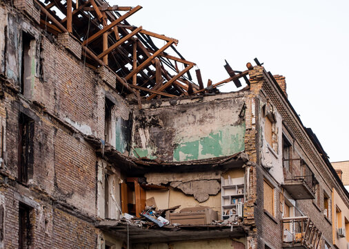 A severely damaged building on Dehtiarivska Street in Kyiv after a Russian missile attack, showing a collapsed roof and exposed interior
