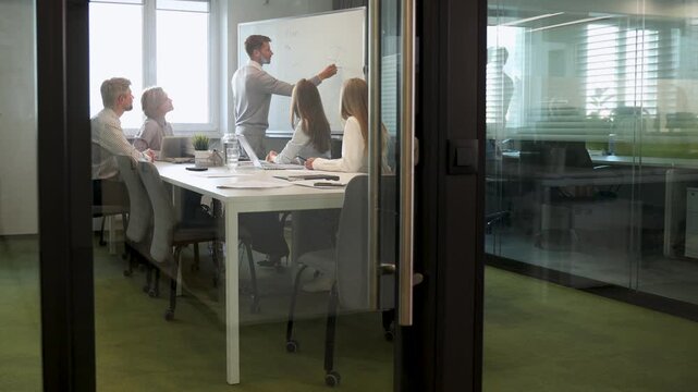 Group of happy progressive business people working on startup together at creative office