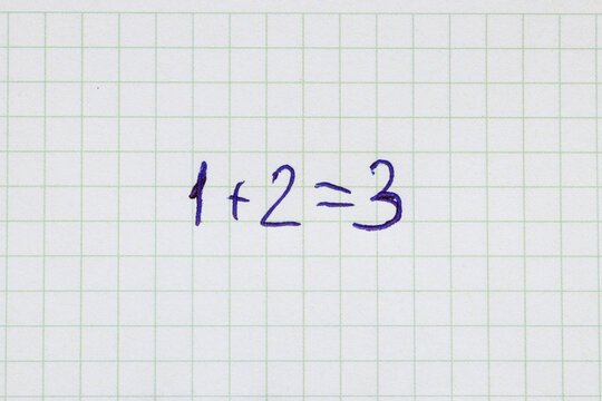 A simple math problem: 1 2 3, written in blue pen in a grid notebook. School, mathematics