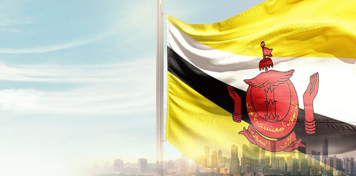 Brunei national flag wavering in beautiful clouds with building skyline. Modern Building skyline with national flag. Brunei national flag for independence day.
