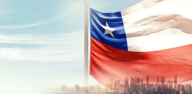 Chile national flag wavering in beautiful clouds with building skyline. Modern Building skyline with national flag. Chile national flag for independence day.