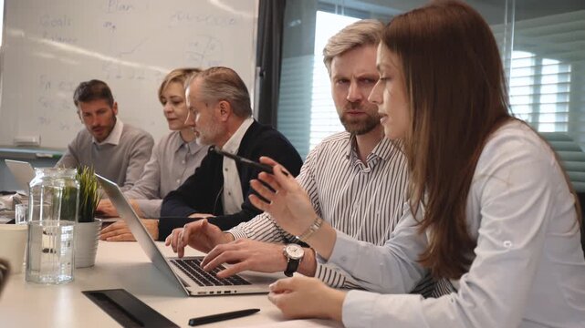 Group of happy progressive business people working on startup together at creative office