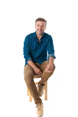 Handsome mature man sitting on stool © Viorel Sima