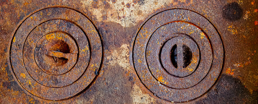 rusty rings of iron burner of an old wood stove