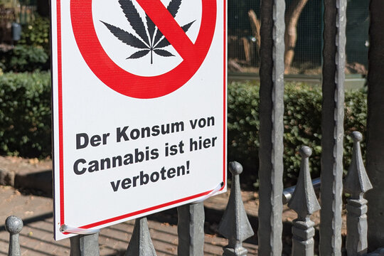 Viernheim, Germany - July 30th 2026: Close up of German sign with crossed‑out cannabis leaf saying 'Cannabis consumption is prohibited here' on fence of public bird park