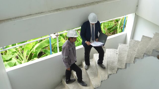 Construction inspectors and engineer discussing project details at an unfinished building site, teamwork, communication, safety compliance, site supervision, safety, construction project management.