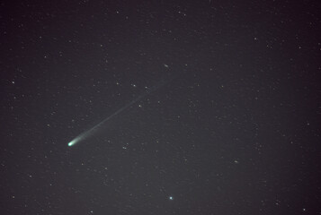Bright Comet with Greenish Coma and Long Faint Dust Tail in Deep Space Star Field © Veljko Klarić