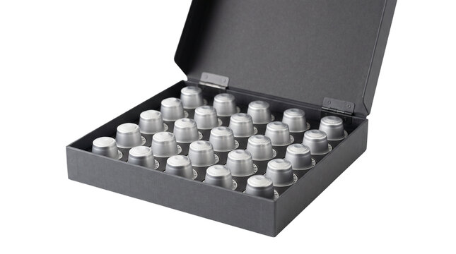 Premium coffee capsules in black gift box, silver espresso pods collection, luxury caffeine assortment for home brewing