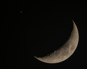 Crescent Moon and Saturn Conjunction showing Lunar Craters and Planetary Rings © Veljko Klarić
