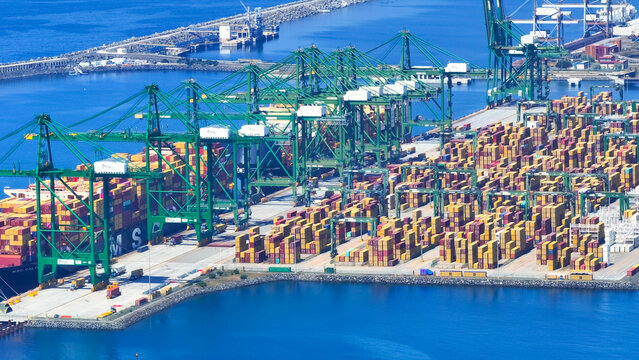 Sines, Setubal, Portugal - 20 June 2026: Aerial view of the large container port with cargo ships, shipping containers, gantry cranes and coastal logistics infrastructure.