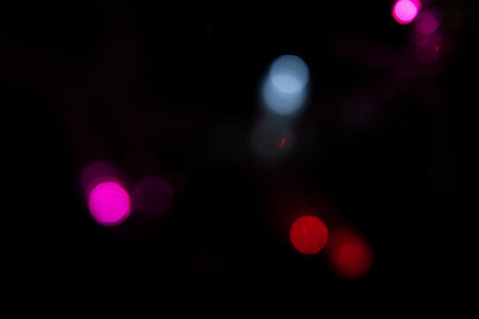 Colorful bokeh lights on black background