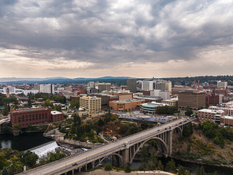 Spokane, Washington, United States - 15 August 2026: Aerial view of the Monroe Street Bridge spanning the Spokane River with the downtown skyline and historic buildings.