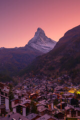 Vertical photo. Sunset view over the town of Zermatt with Matterhorn mountain in the background....