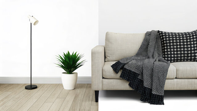 Beige sofa with patterned pillow textured throw blanket and floor lamp with potted plant on white background