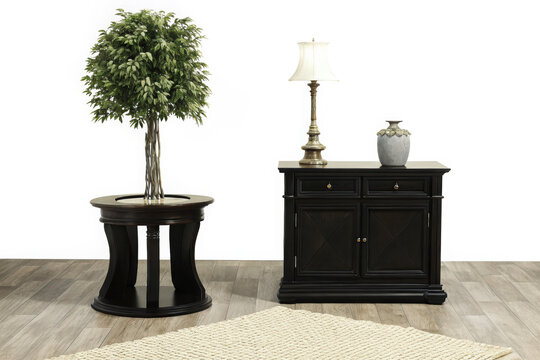 Dark wood accent table with artificial tree and decorative lamp and vase on wooden floor interior wooden table