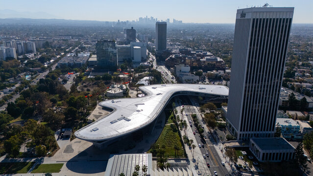 Los Angeles, California, United States - 26 August 2026: Aerial view of the Newly opened David Geffen Galleries, surrounded by urban streets, palm trees, and skyscrapers.