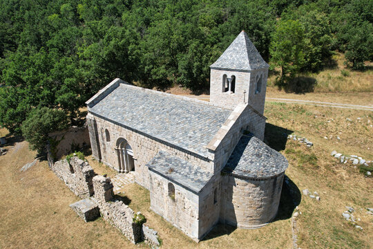 Drone view of the Romanesque Chapelle de Sant Marti, an 12th-century stone church nestled in the Pyrenees mountains, Corsavy, France.