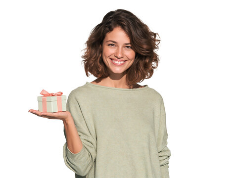 Smiling young woman holding a small gift box on her open palm isolated on transparent or white background, png