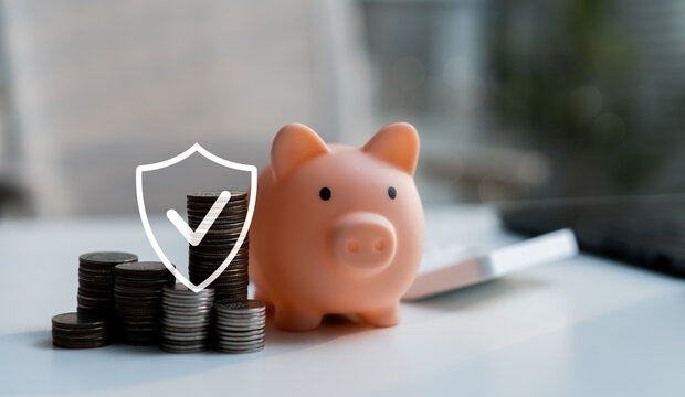 Piggy bank with stacked coins and security shield icon represents savings protection, financial security, money management, safe investment, wealth planning and personal finance concept.