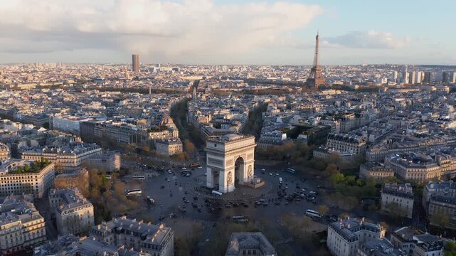 Aerial view of the Arc de Triomphe and the Eiffel Tower overlooking the historic cityscape of Paris, Ile-de-France, France.