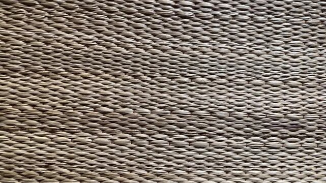 Woven Texture Detail: An abstract close-up showcases the intricate weaving pattern of a natural fiber material, highlighting its organic texture and earthy tones.