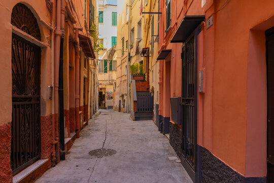 Cozy narrow street with drying laundry in Liguria district, Sanremo, Italy