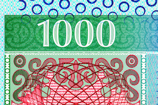 1000 Mauritanian Ouguiya banknote. National currency of Mauritania, close-up view showing traditional Arabic calligraphy and security elements.