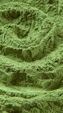 Chlorella or spirulina algae green powder is spinning. Dietary supplement to improve health. Seaweed superfood. Healthy food background. Vitamins to diet. Detox. Close up vertical format video