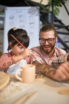 creative Girl with teacher on pottery workshop.  Creative, hobby ,workshop  concept