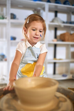 messy child pupil making clay pot on pottery workshop class. Creative, hobby ,workshop  concept