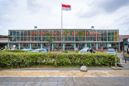 Jakarta, Indonesia - September 7, 2026: Pasar Senen Railway Station building with the Indonesian flag and station signage, viewed from the front plaza.