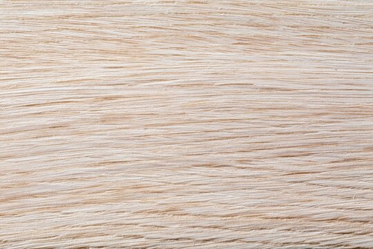 The Light Wooden Surface with Subtle Grain Pattern and Natural Texture