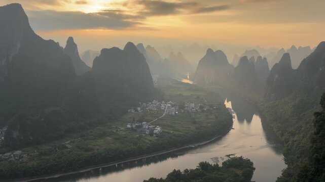 Panoramic sunset view of the Li River flowing through karst mountains in rural Guilin China