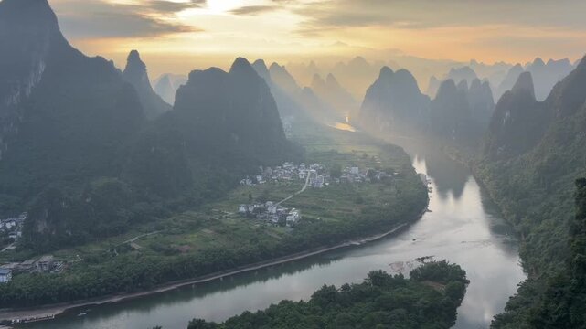 Panoramic sunset view of the Li River flowing through karst mountains in rural Guilin China