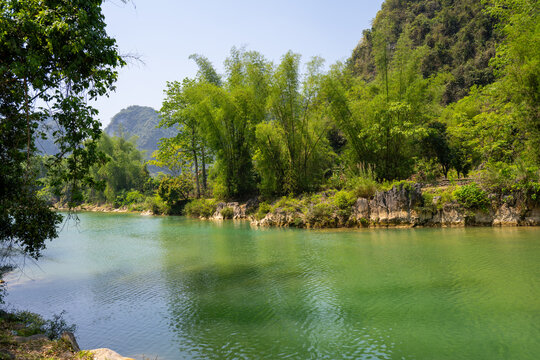 River flowing through lush landscape in Xa am Thuy