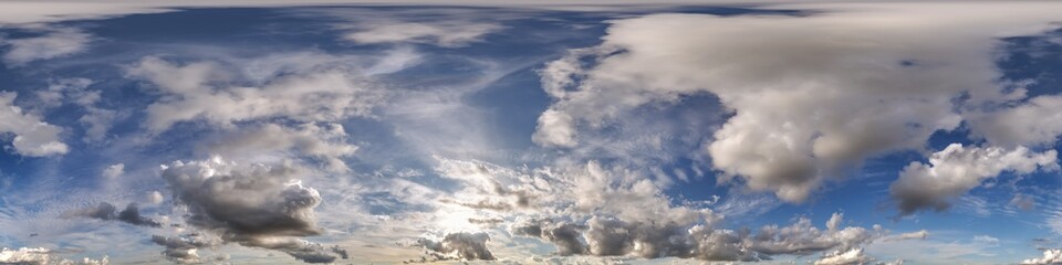 Fototapeta premium 360 hdri blue sky with beautiful clouds with halo like a seamless panorama view with zenith for use in 3d graphics or game development as sky dome or edit drone shot