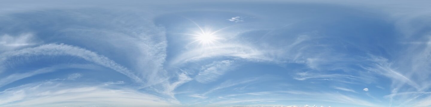 360 hdri blue sky with beautiful clouds with halo like a seamless panorama view with zenith for use in 3d graphics or game development as sky dome or edit drone shot
